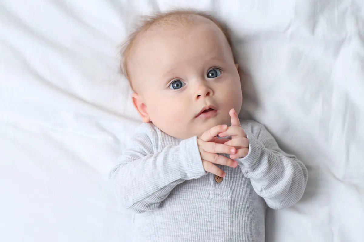 When do babies discover their hands?