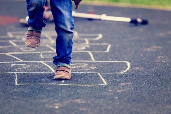 How do children develop their balance?